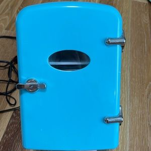 Light blue mini fridge